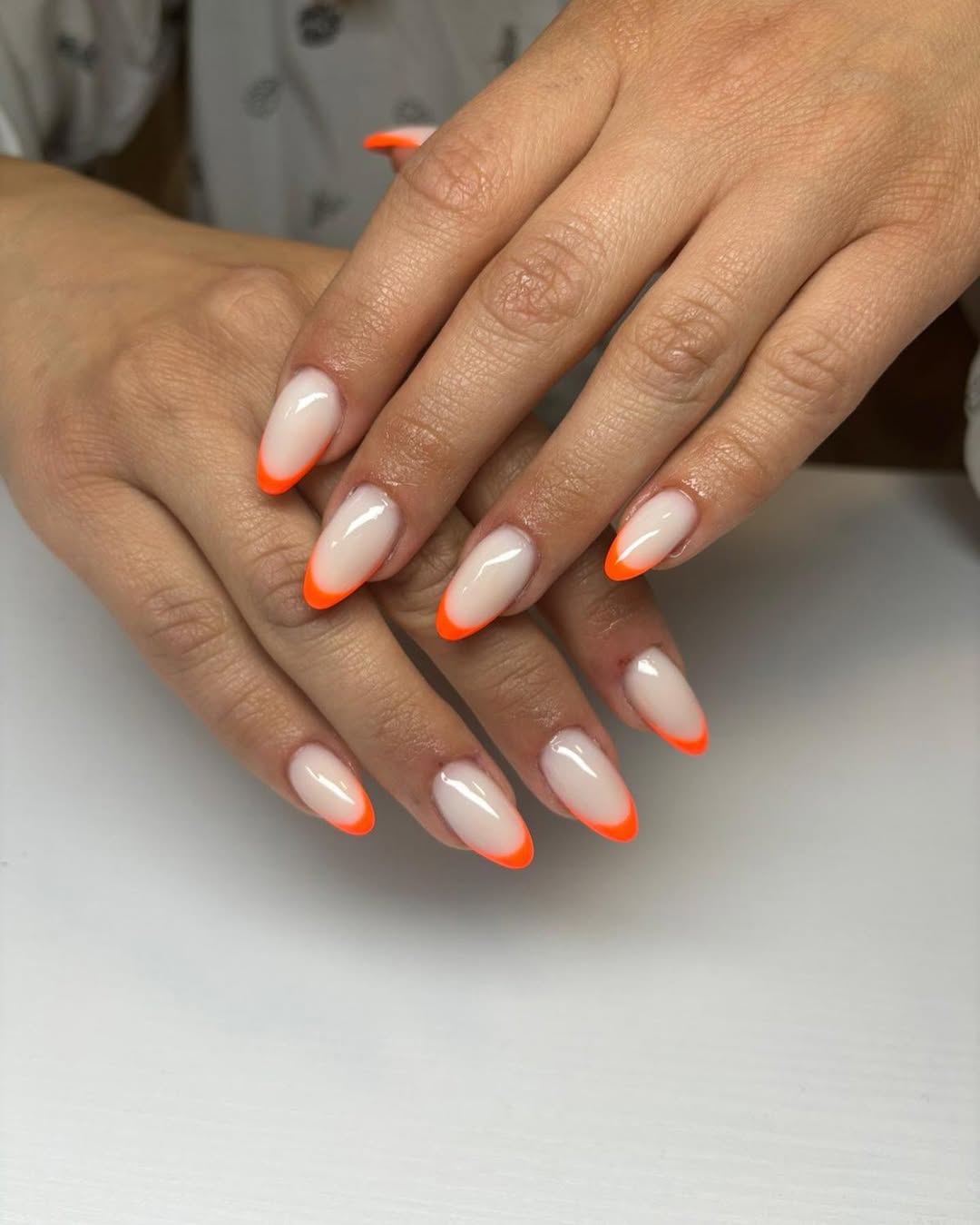 Vibrant Orange French Tip Almond Nails