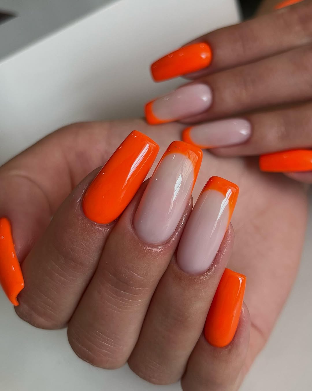 Vibrant Orange French Tips and Solid Nails