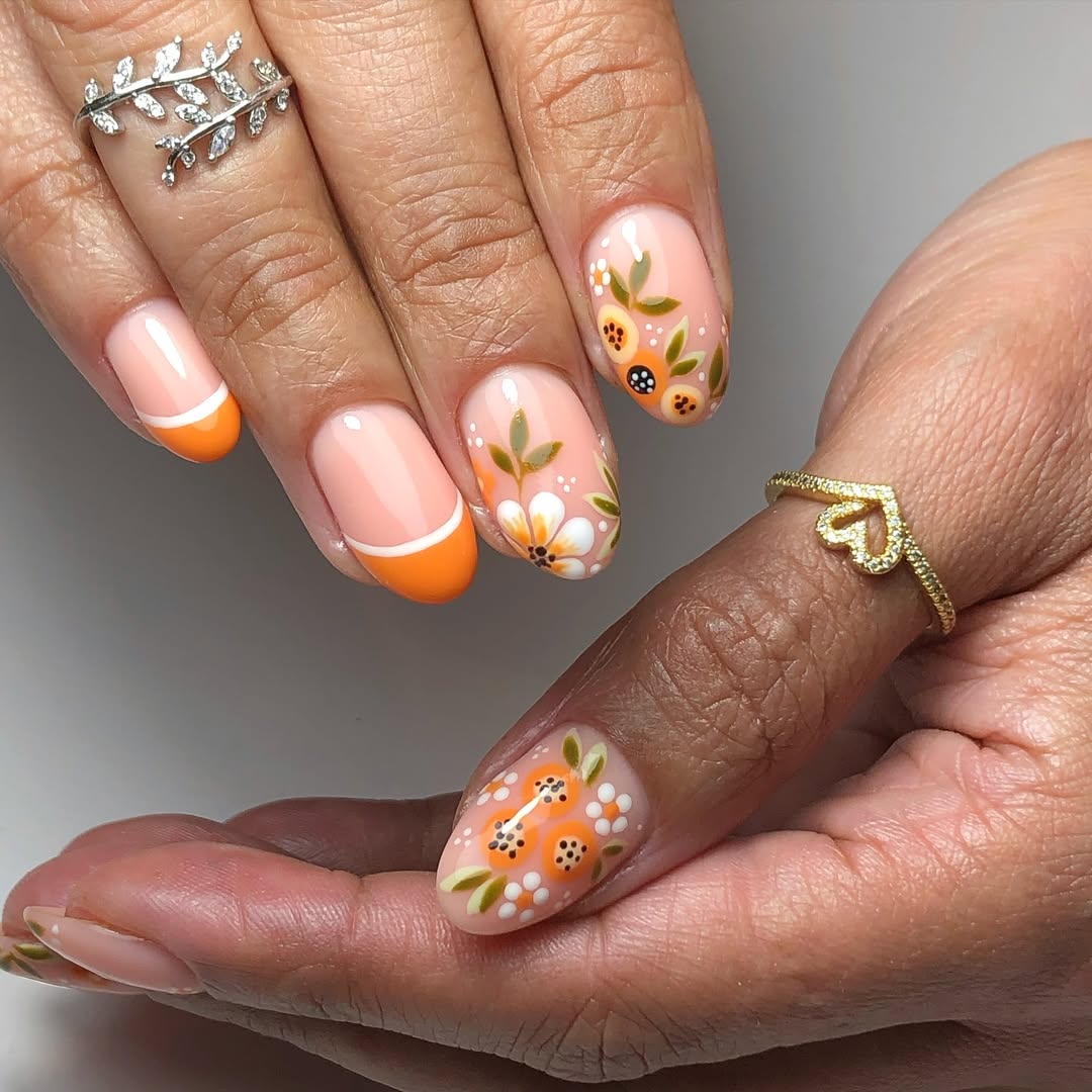 Vibrant Orange French Tips with Floral Art