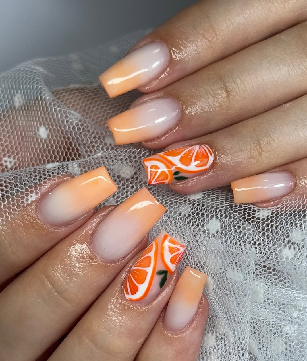 Vibrant Orange Ombre with Citrus Slice Accents