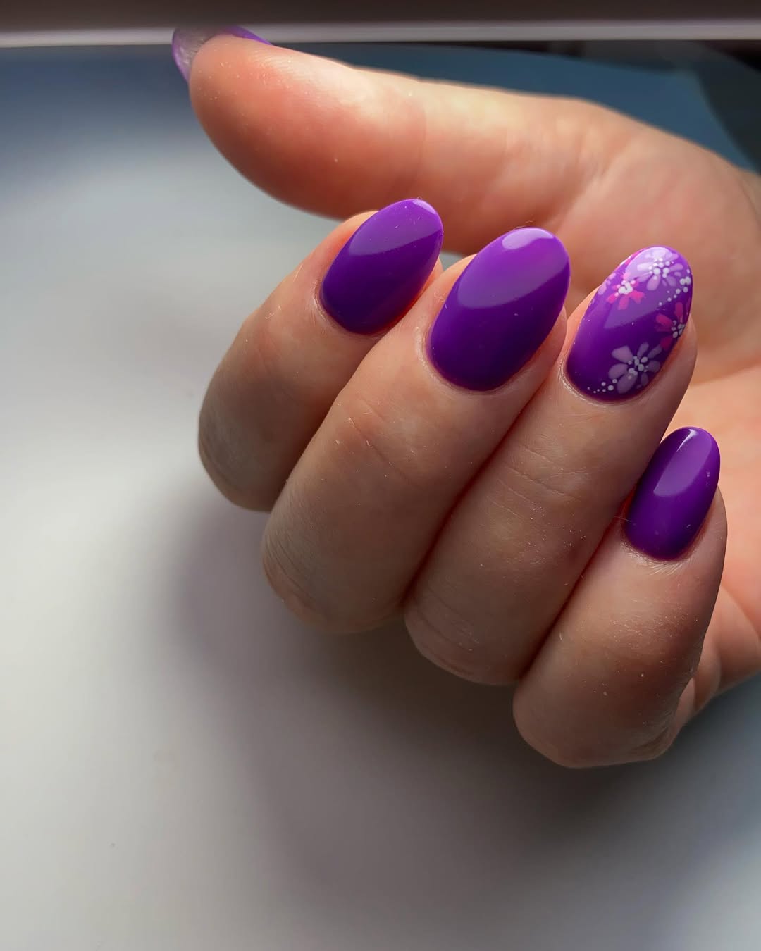 Vibrant Purple Almond Nails With Floral Accents