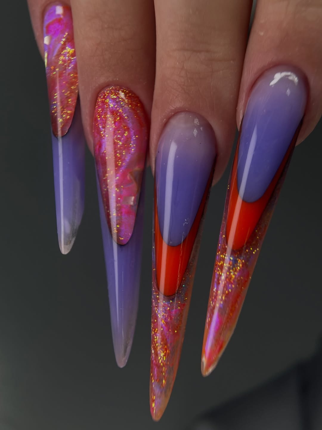 Vibrant Purple and Glitter Stiletto Nails