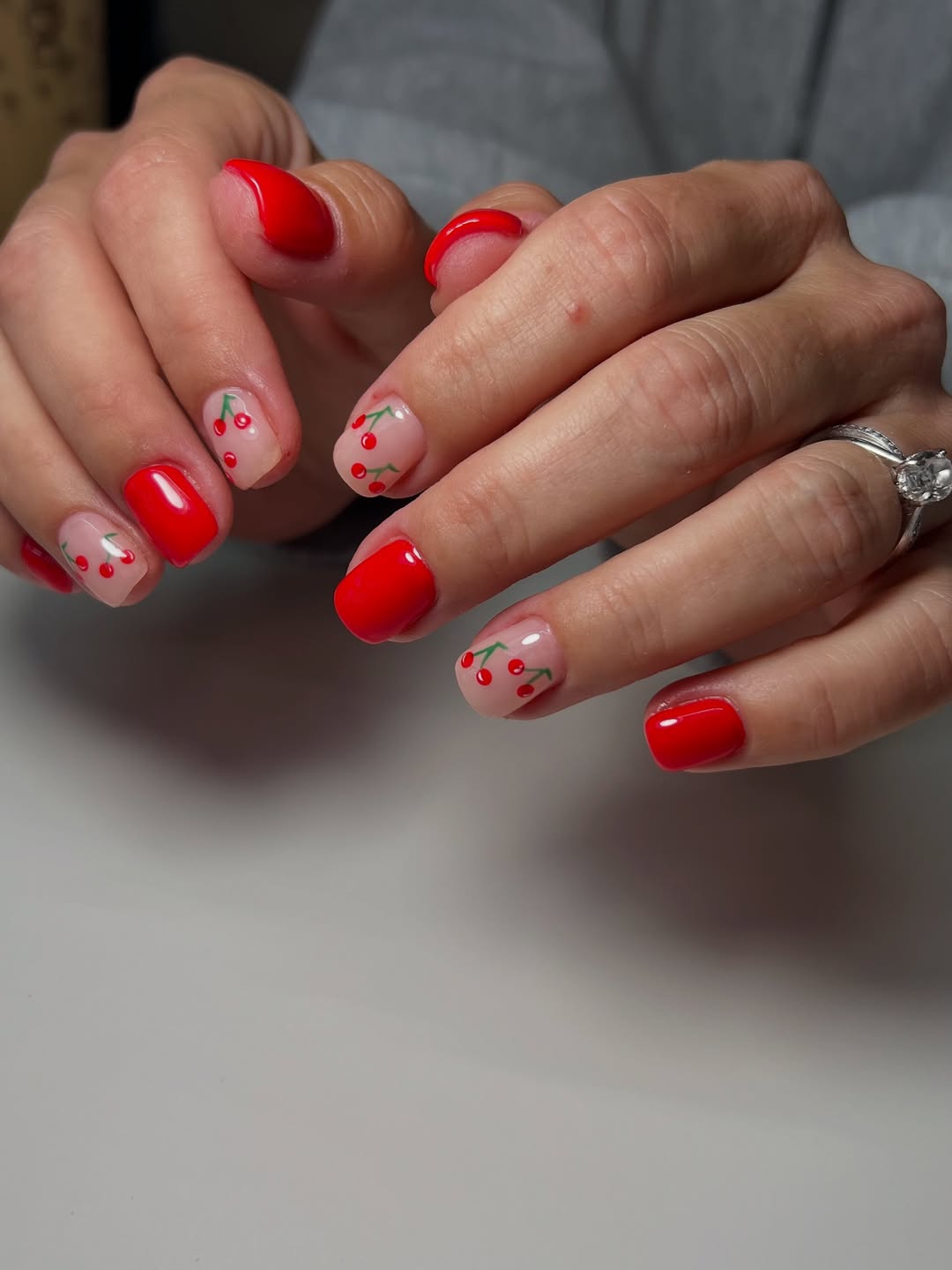 Vibrant Red And Cherry Art Short Gel Nails