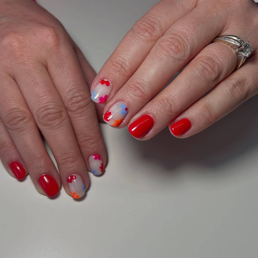 Vibrant Red Nails With Sweet Daisy Accents