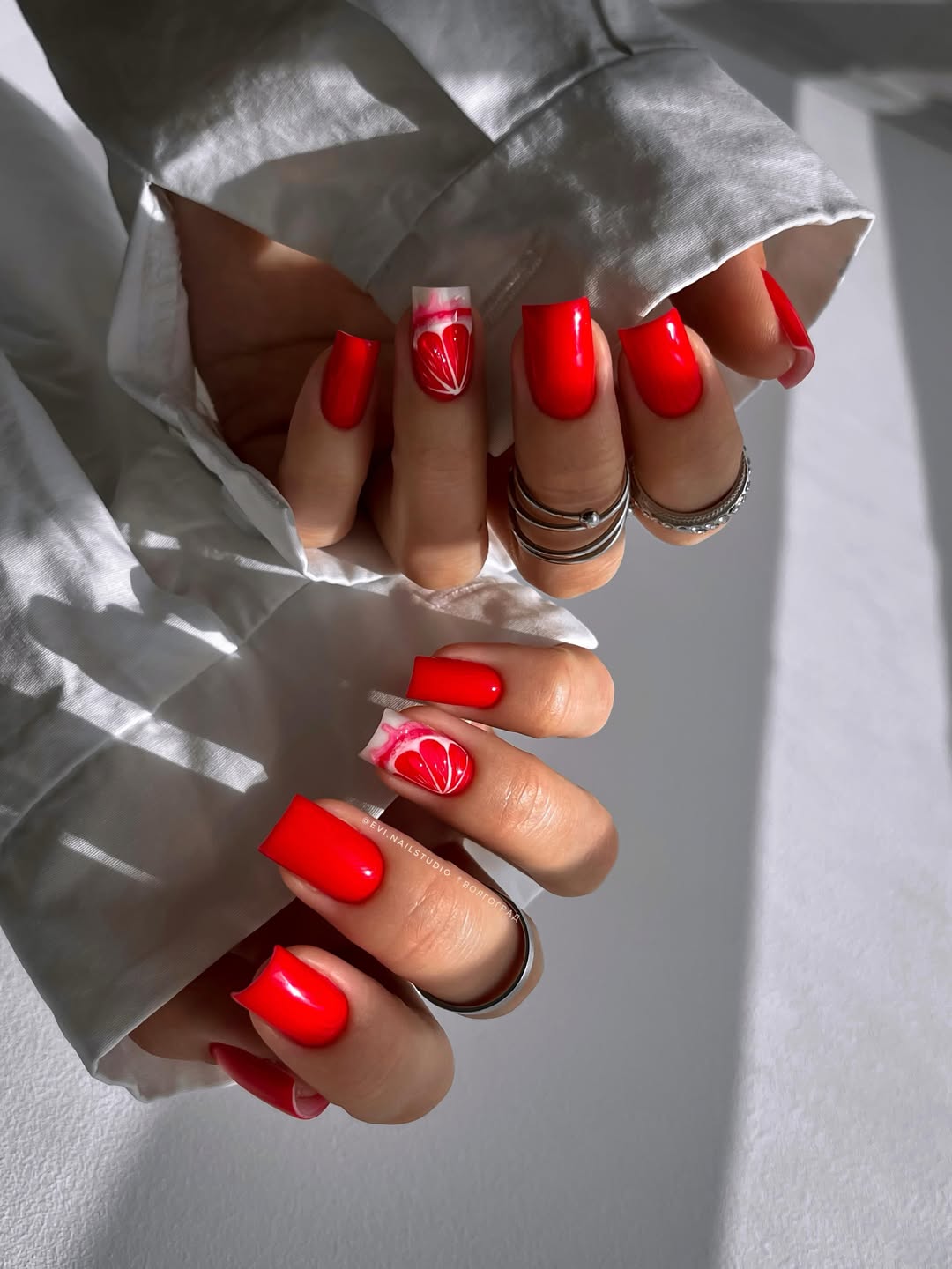 Vibrant Red Square Nails with Citrus Slice Art