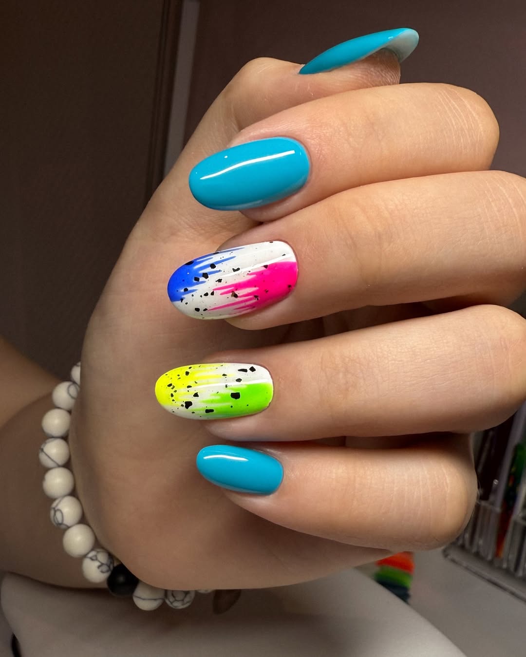 Vibrant Splash Nails with Speckled Detail