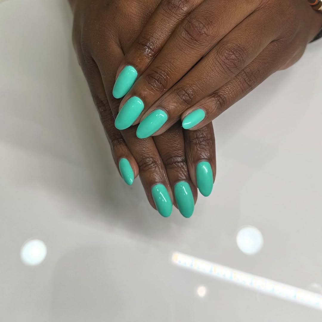 Vibrant Teal Glossy Oval Nails