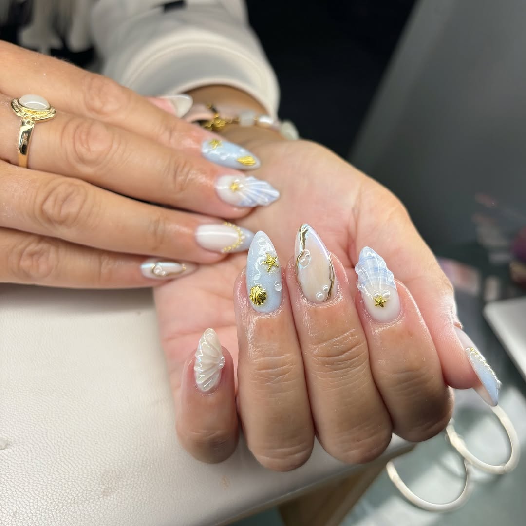Whimsical Ocean Blue Pearl Shell Stiletto Nails