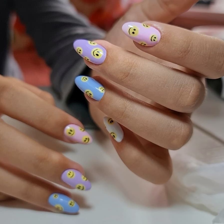 Whimsical Pastel Smiley Face Almond Nails