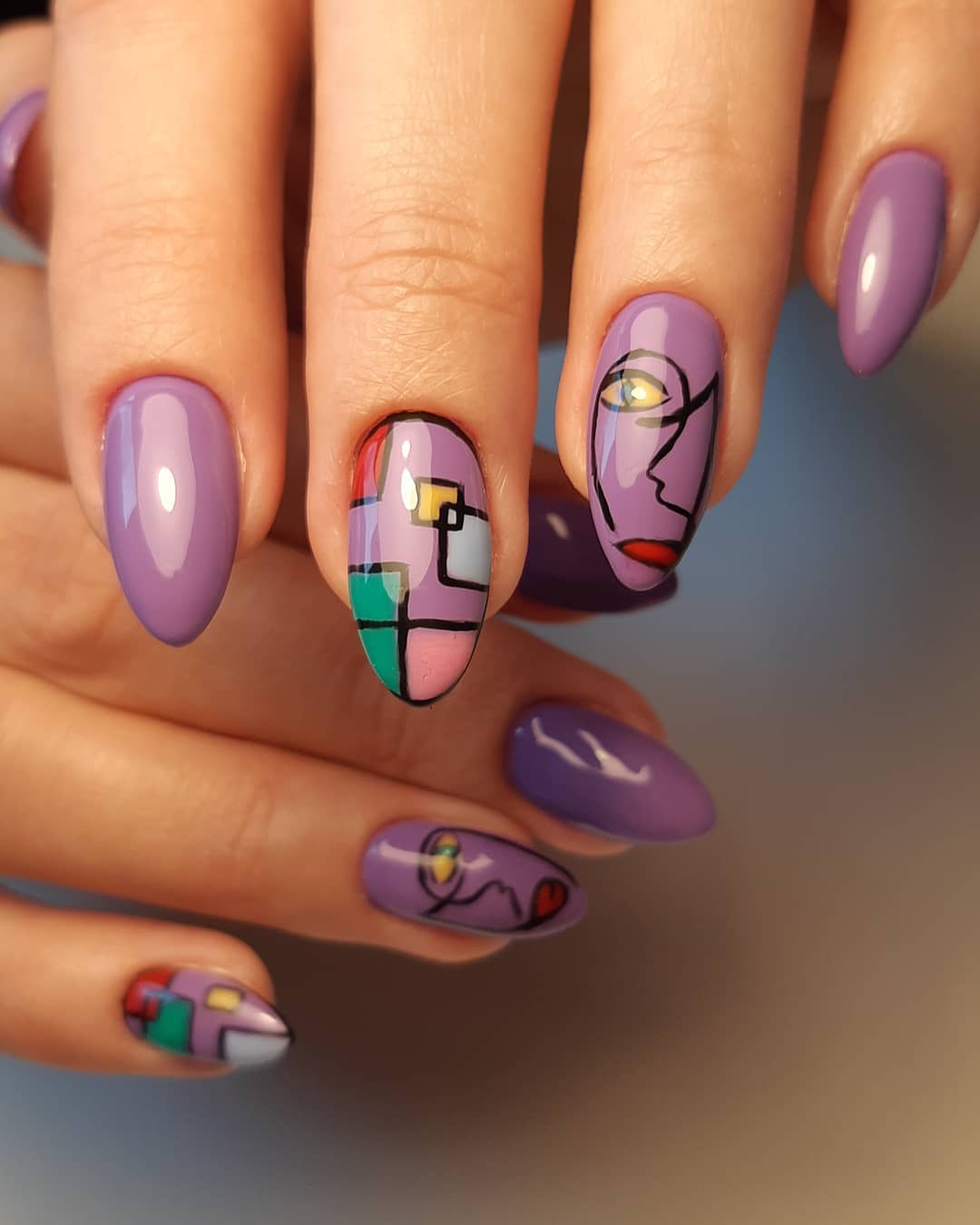 Whimsical Purple Glossy Picasso-Inspired Nail Art