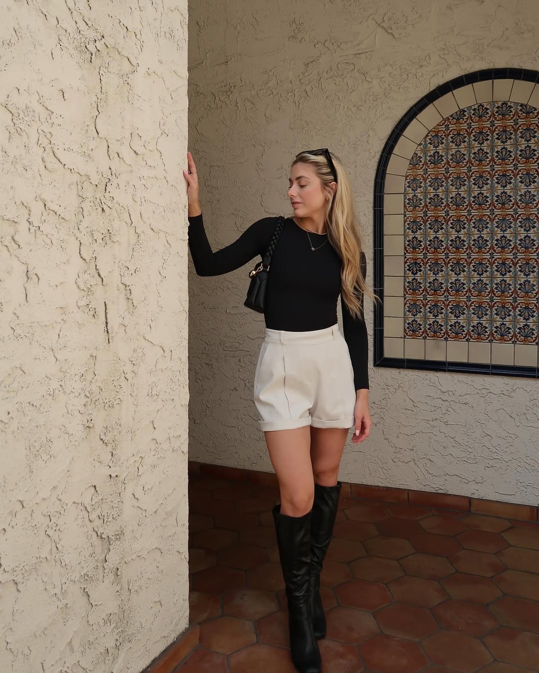 Black Long Sleeve With Cream Shorts And Tall Boots