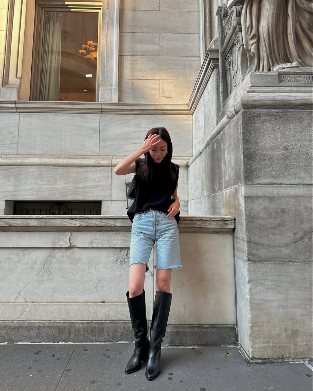 Black Sleeveless Top With Distressed Denim Shorts