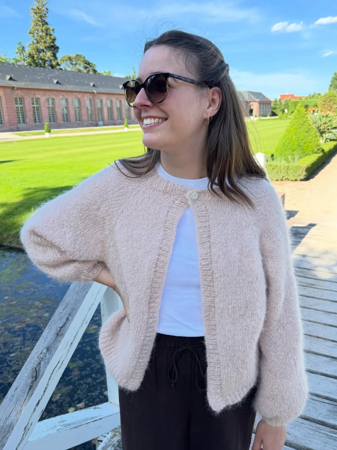 Blush Mohair Cardigan With White Tee And Dark Trousers