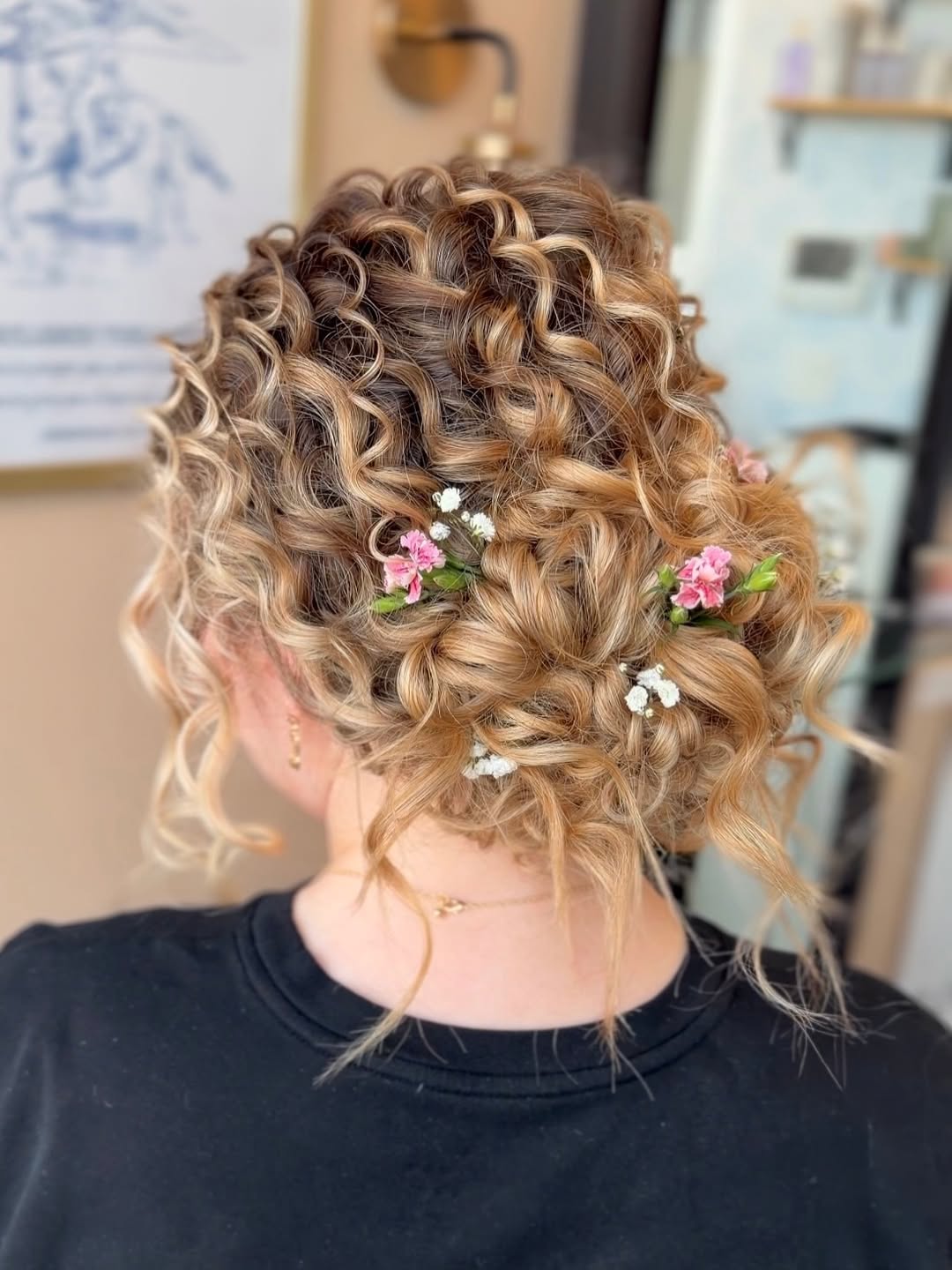 Bohemian Curly Updo With Fresh Flower Accents