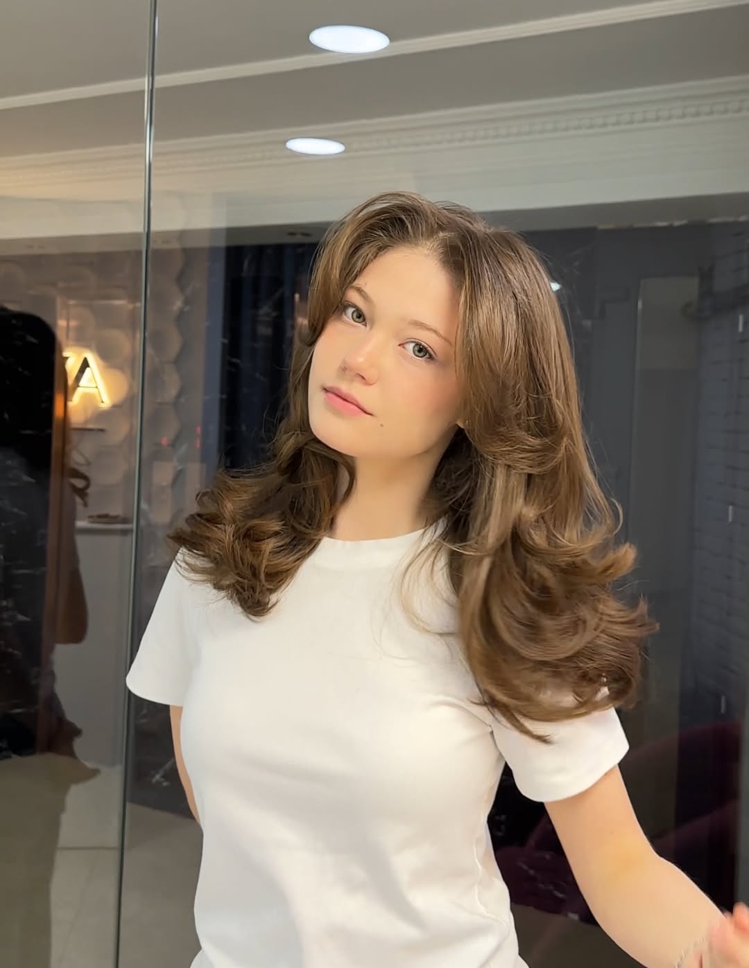 Bouncy Blowout With Soft Layers And Curtain Bangs