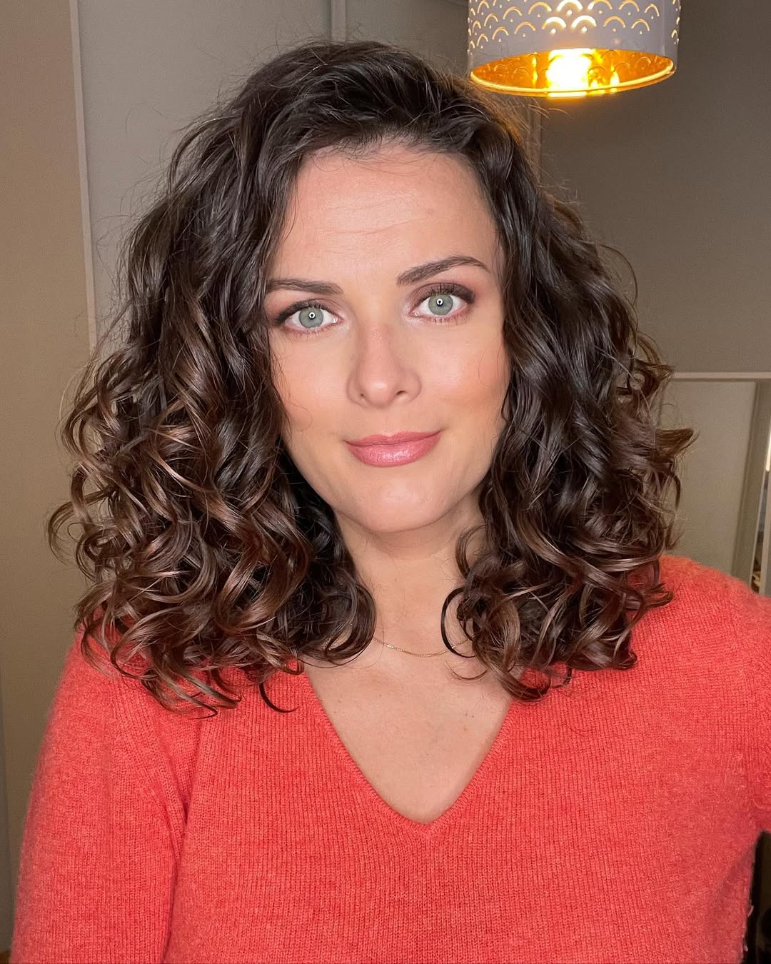 Bouncy Mahogany Curls With Subtle Highlights