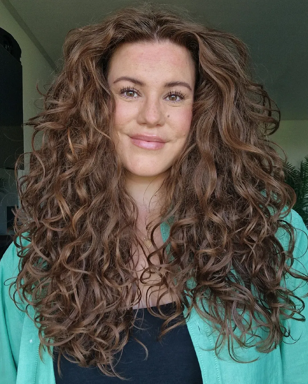 Bouncy Voluminous Auburn Curls With Natural Part