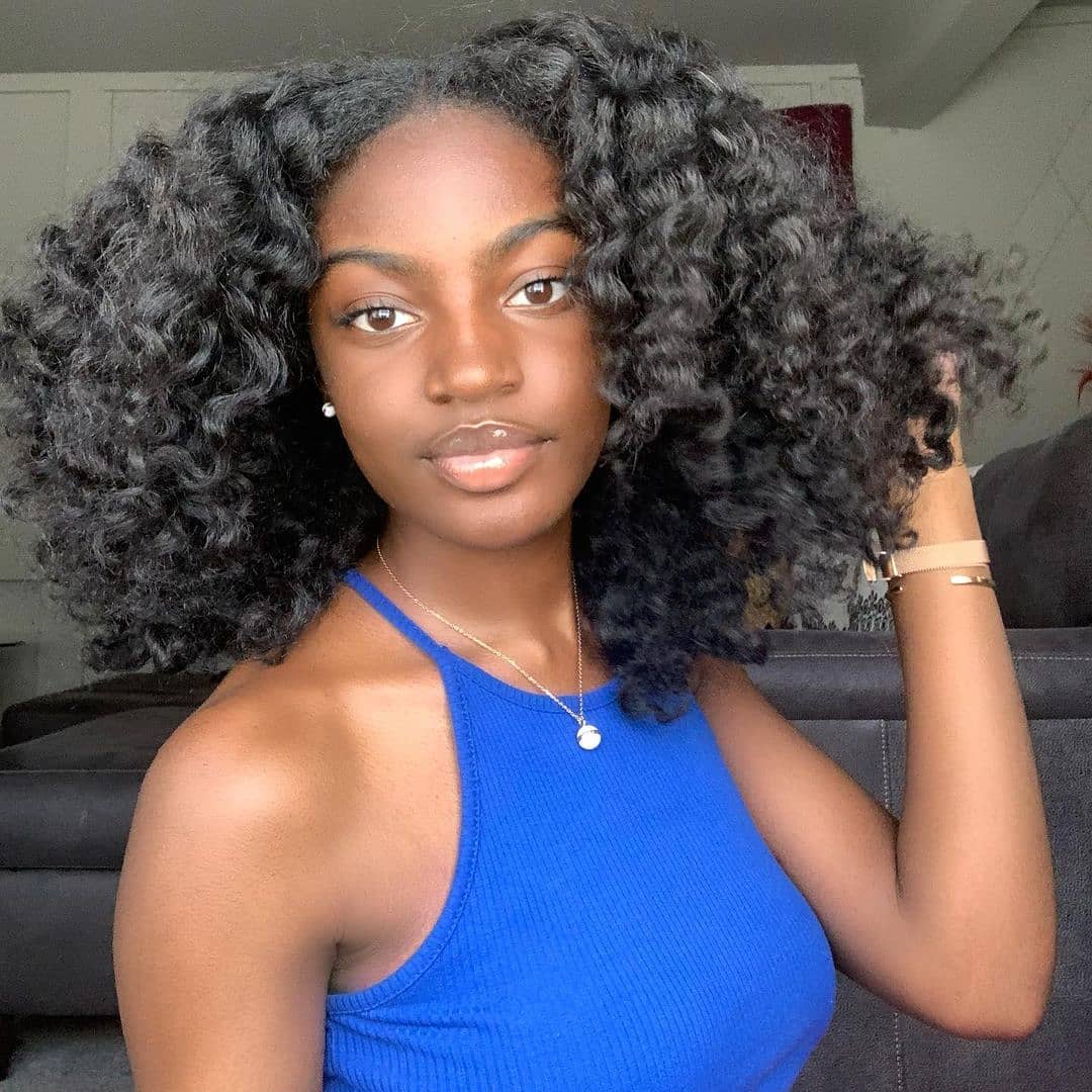 Bouncy Voluminous Defined Coils With Side Part