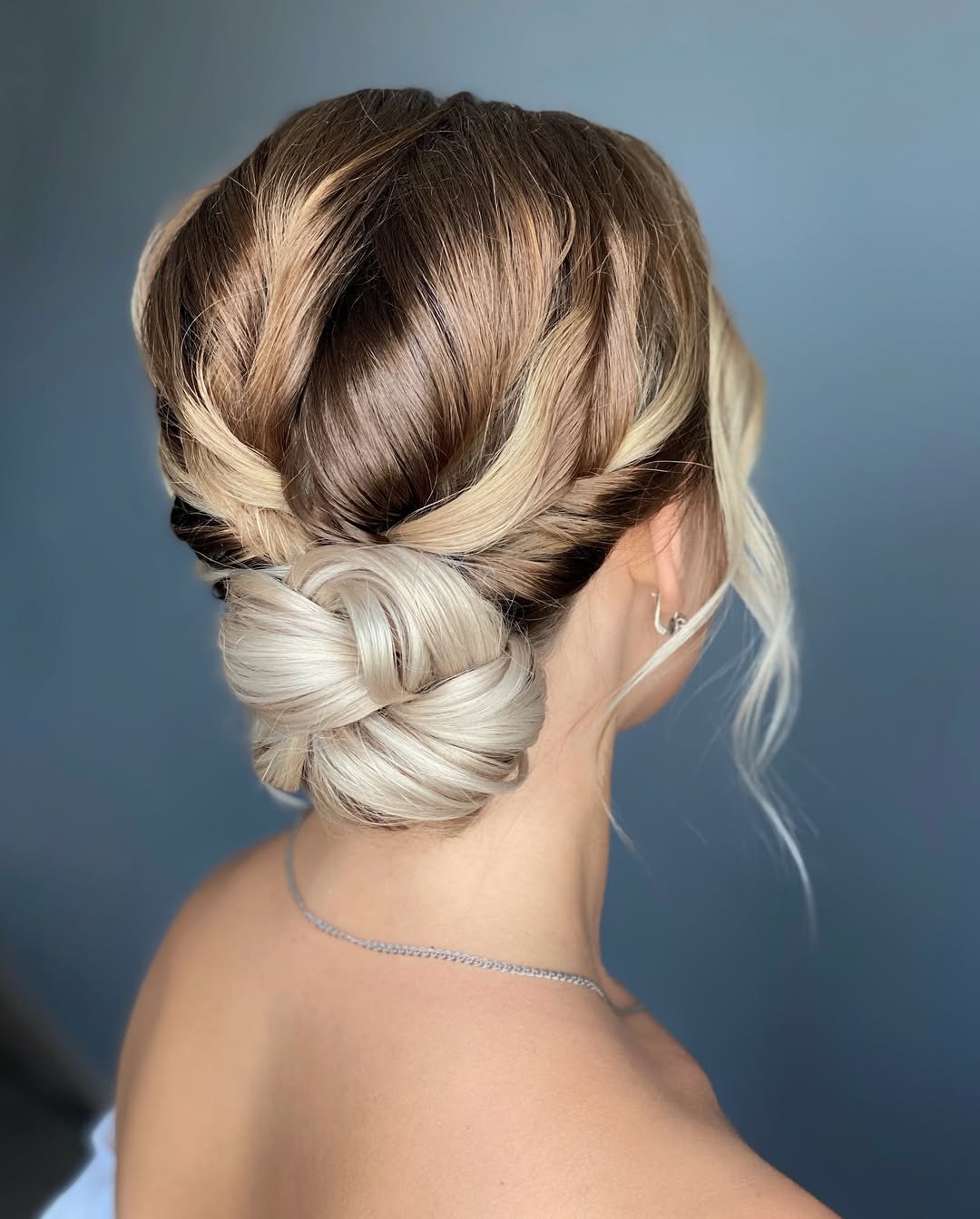 Braided Twisted Low Bun With Face-Framing Curles