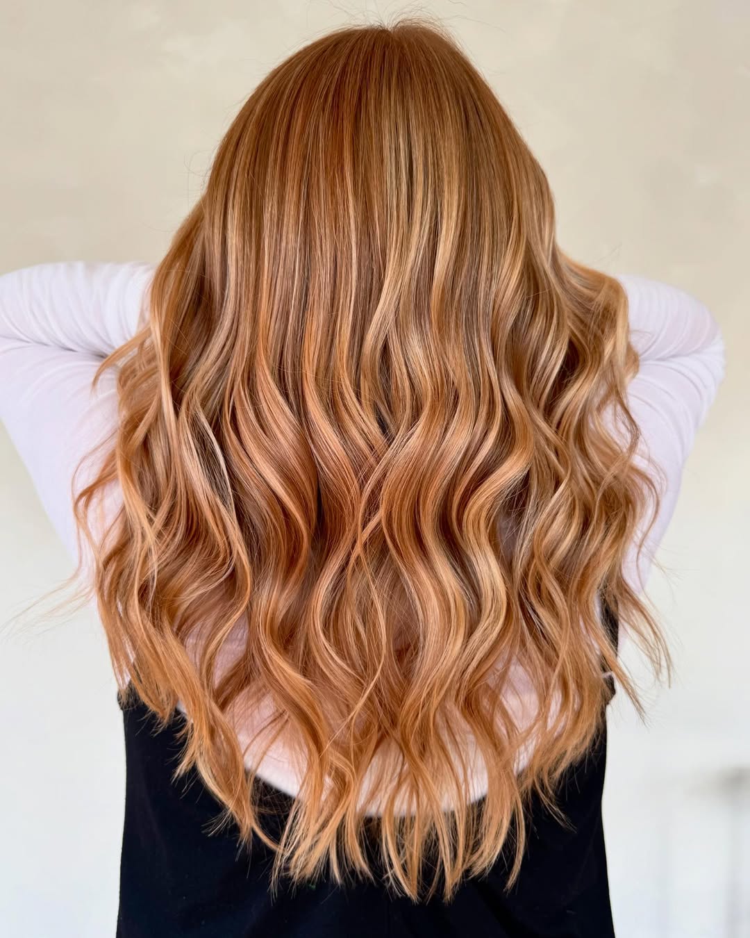 Bright Strawberry Blonde Waves With Face-Framing Highlights