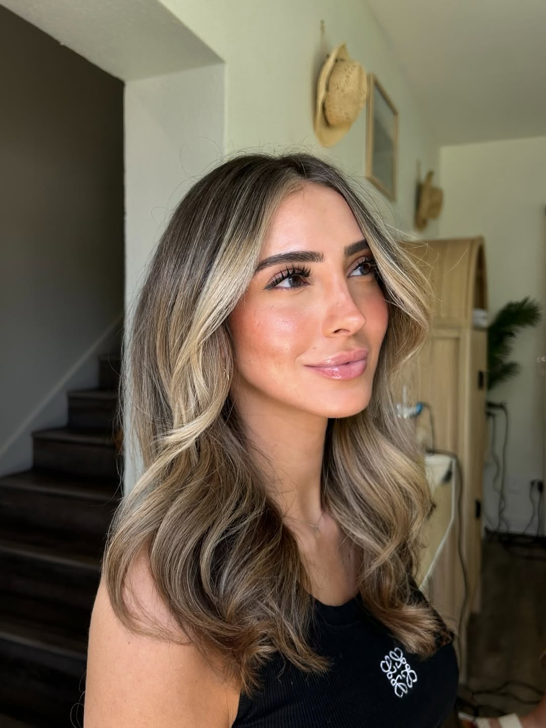 Caramel Blonde Face-Framing Layers With Bouncy Waves