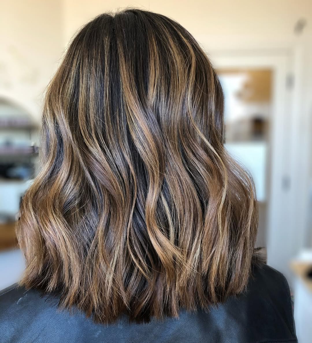 Caramel Highlights On Wavy Medium-Length Balayage