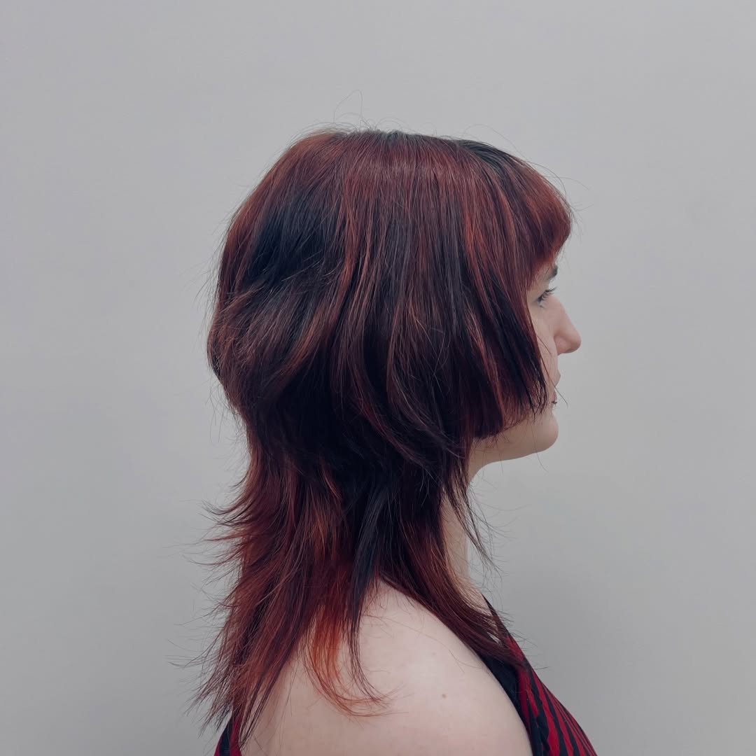 Cherry Red Shag With Blunt Bangs And Layered Ends