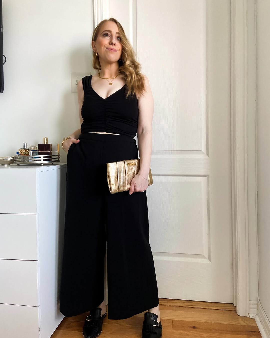 Chic Black Wide-Legged Jumpsuit With Gold Accessories