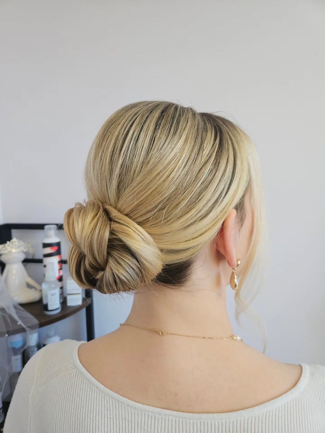 Chic Low Twisted Bun With Honey Blonde Highlights