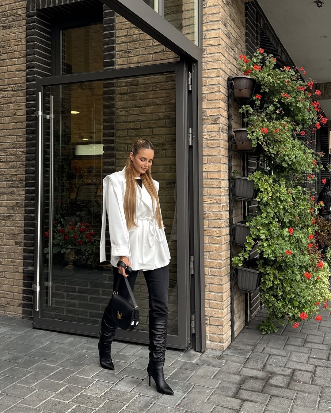 Chic White Blouse With Black Skinny Jeans and Ruched Boots