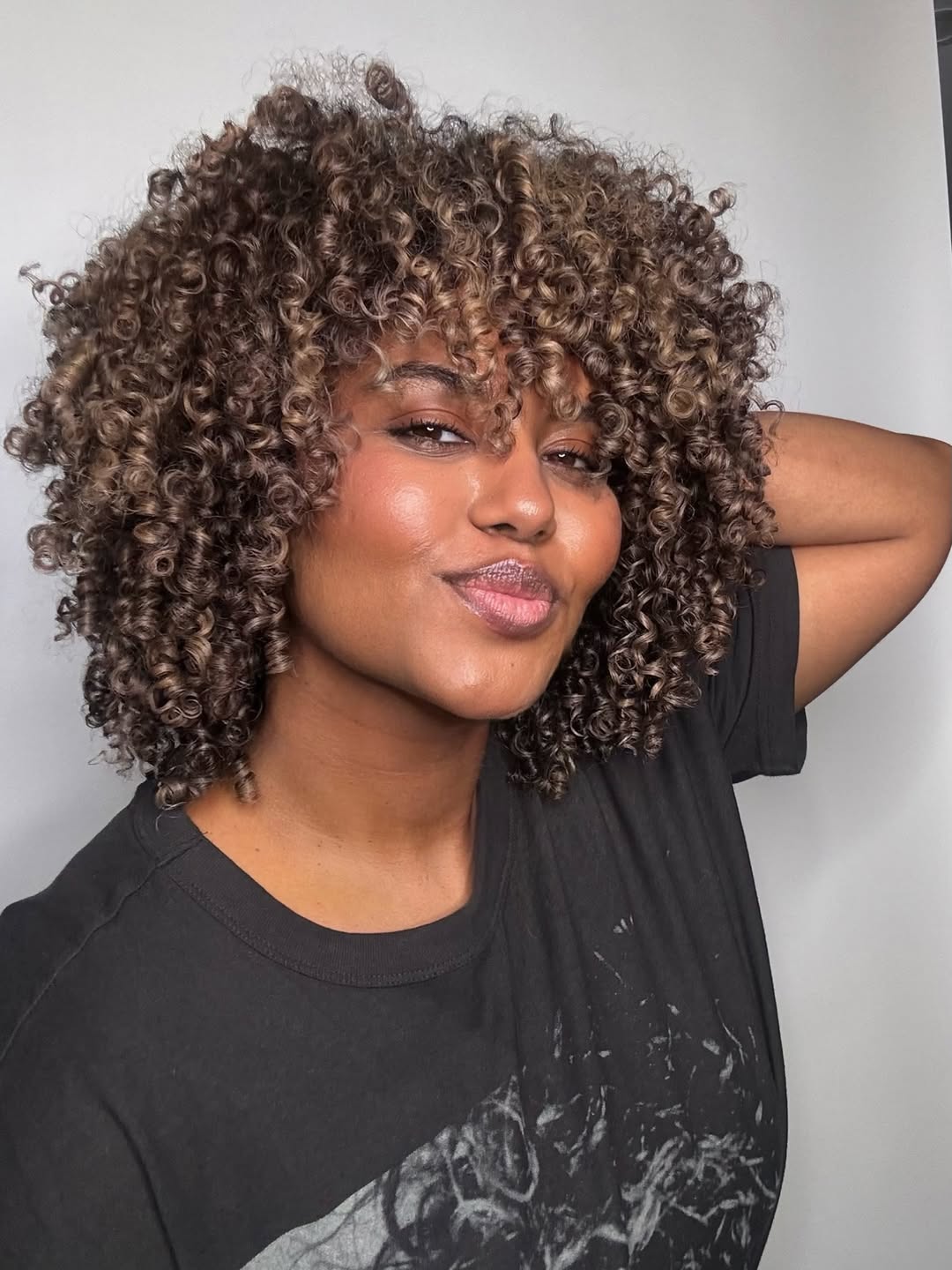 Choppy Layered Curly Bob With Honey Highlights
