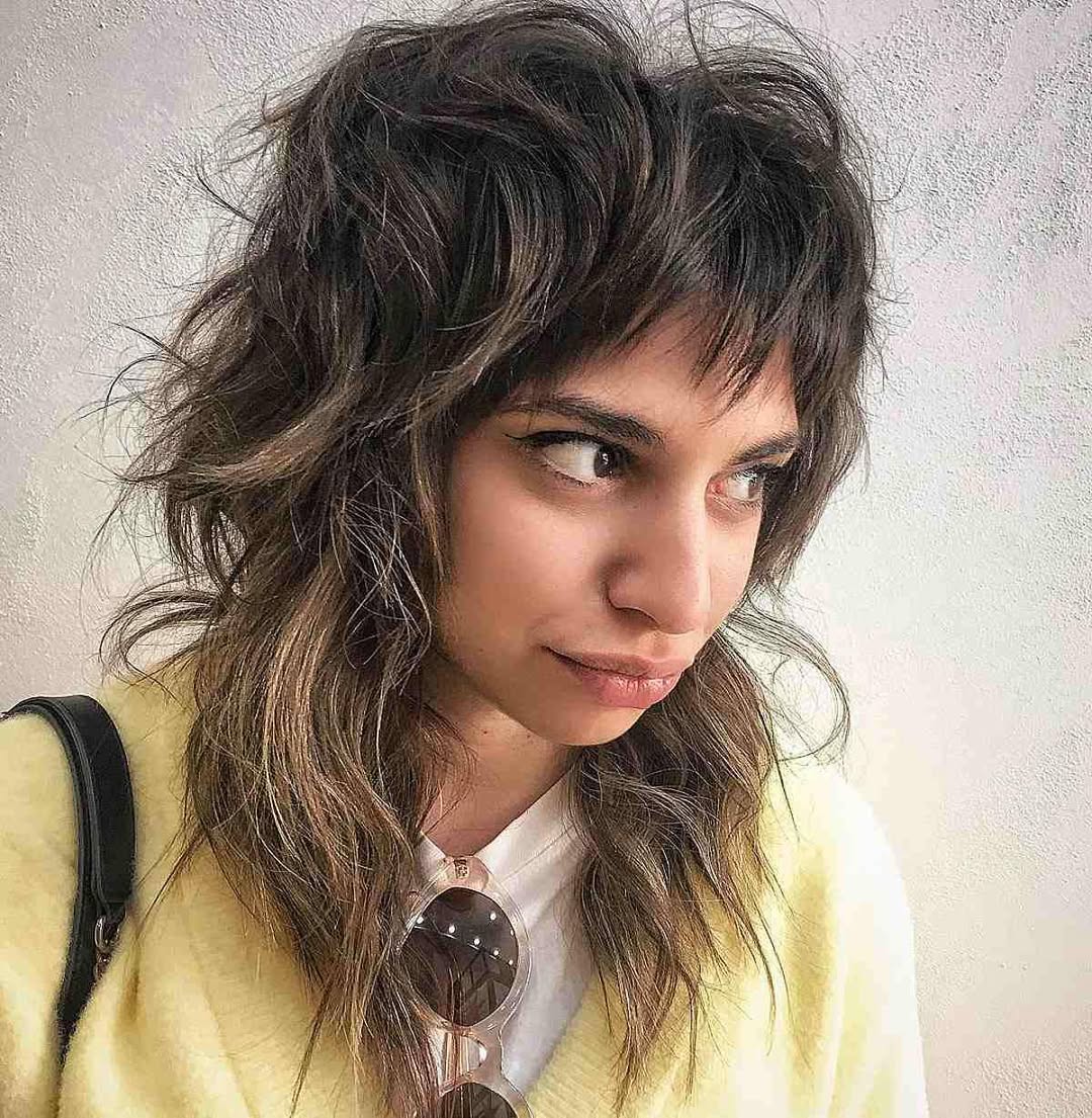 Choppy Layers With Wispy Bangs And Subtle Highlights