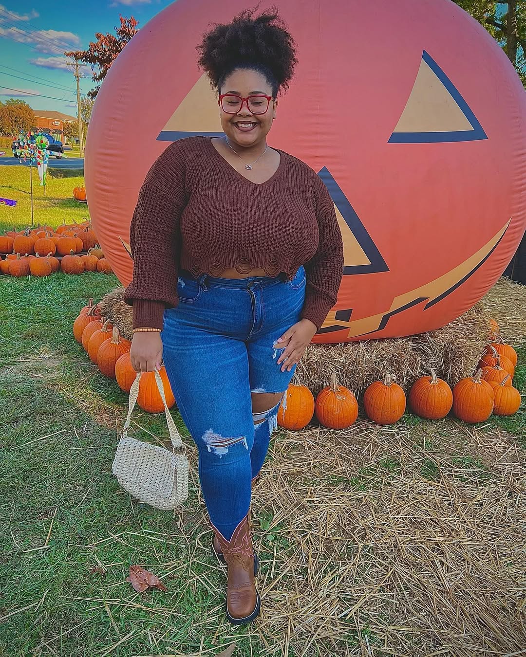 Cozy Cropped Sweater With Ripped Jeans And Cowboy Boots