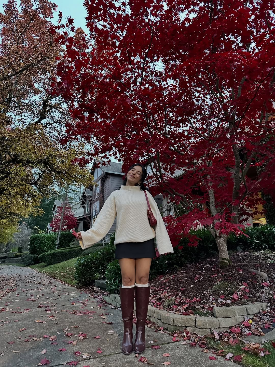Cream Sweater With Knee-High Boots and Mini Skirt