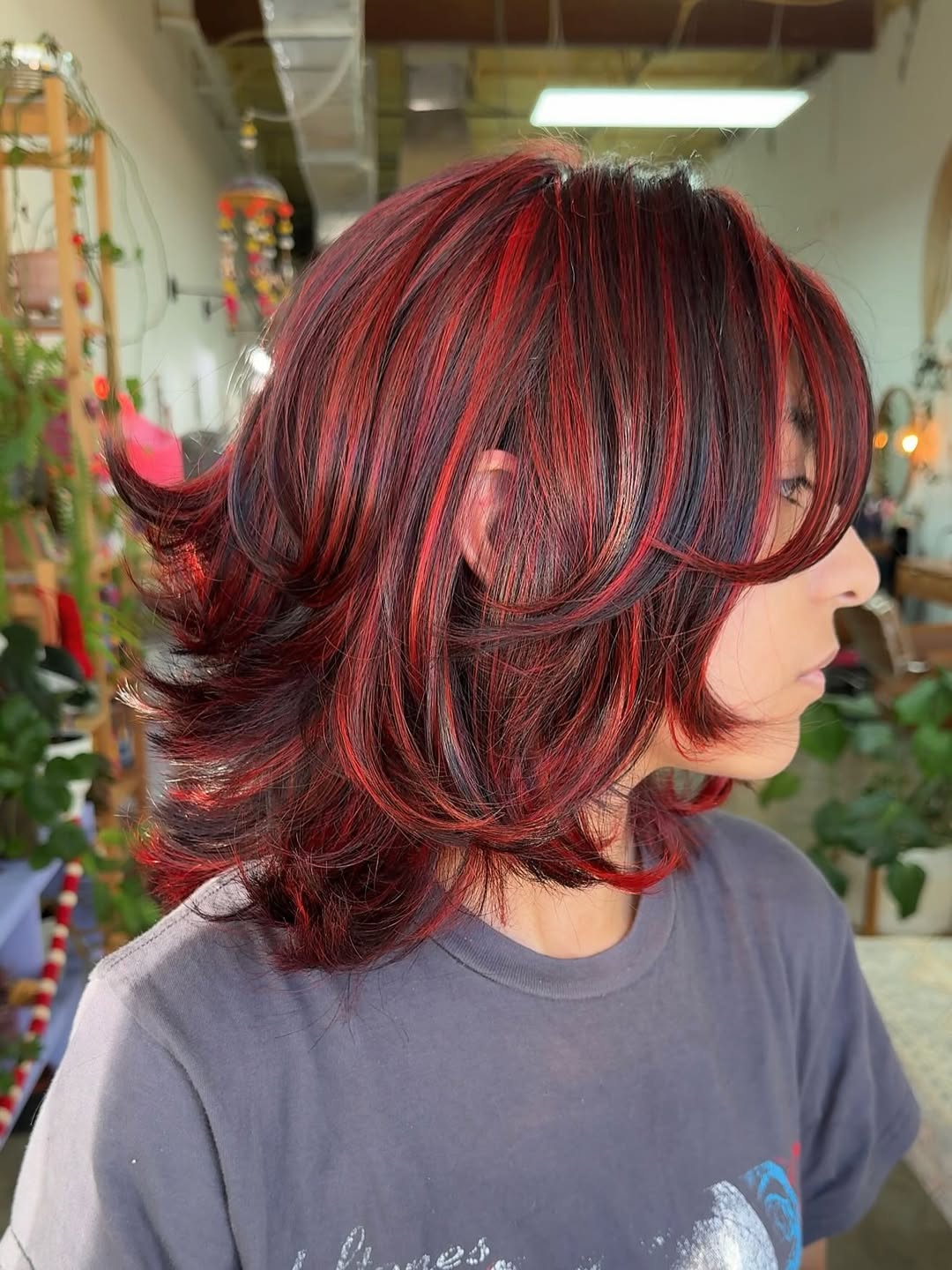 Crimson Highlights With Layered Collarbone Cut