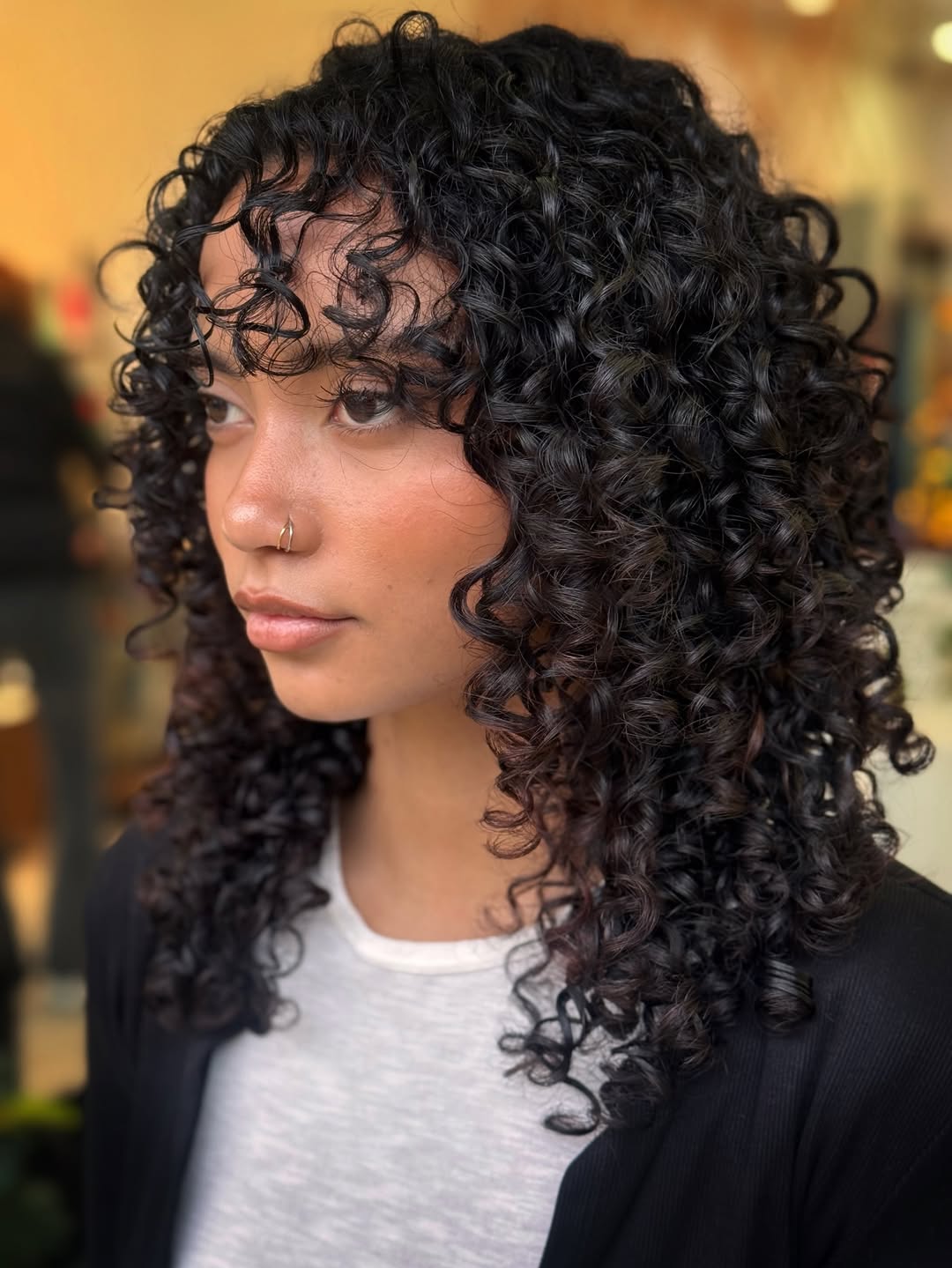 Defined Dark Curly Lob With Full Fringe