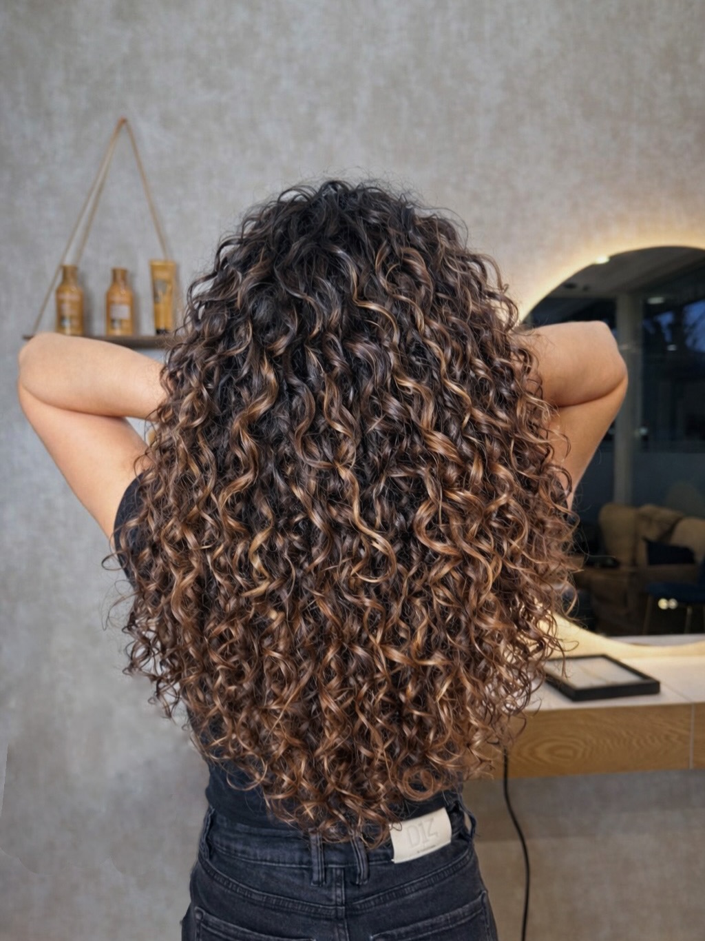 Defined Medium Auburn Curls with Face-Framing Highlights
