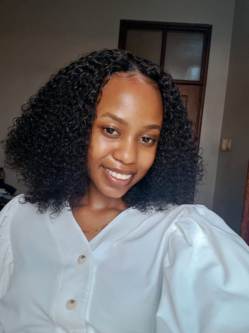 Defined Medium-Length Curly Bob With Middle Part