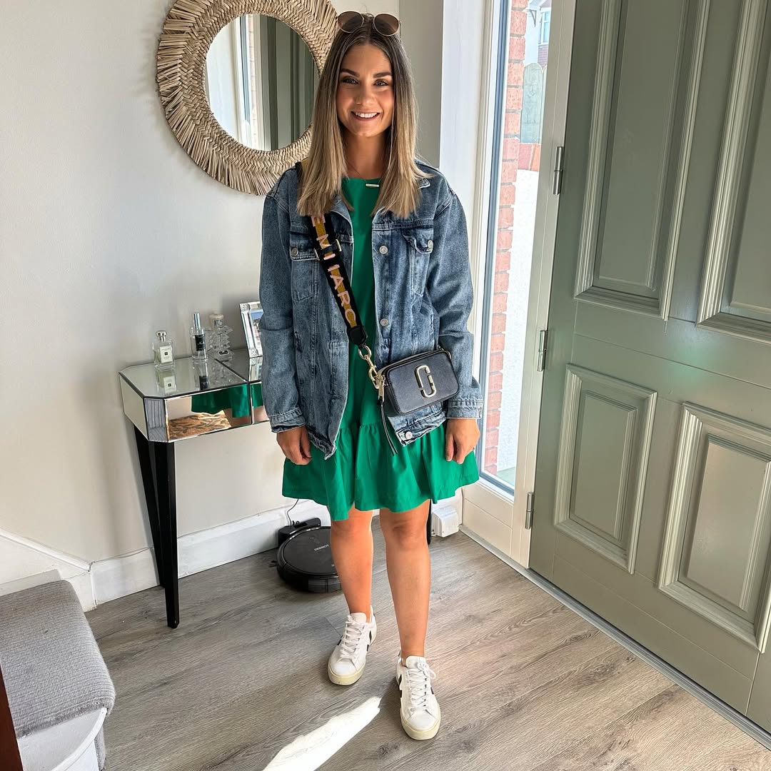 Denim Jacket Over Emerald Tiered Mini Dress