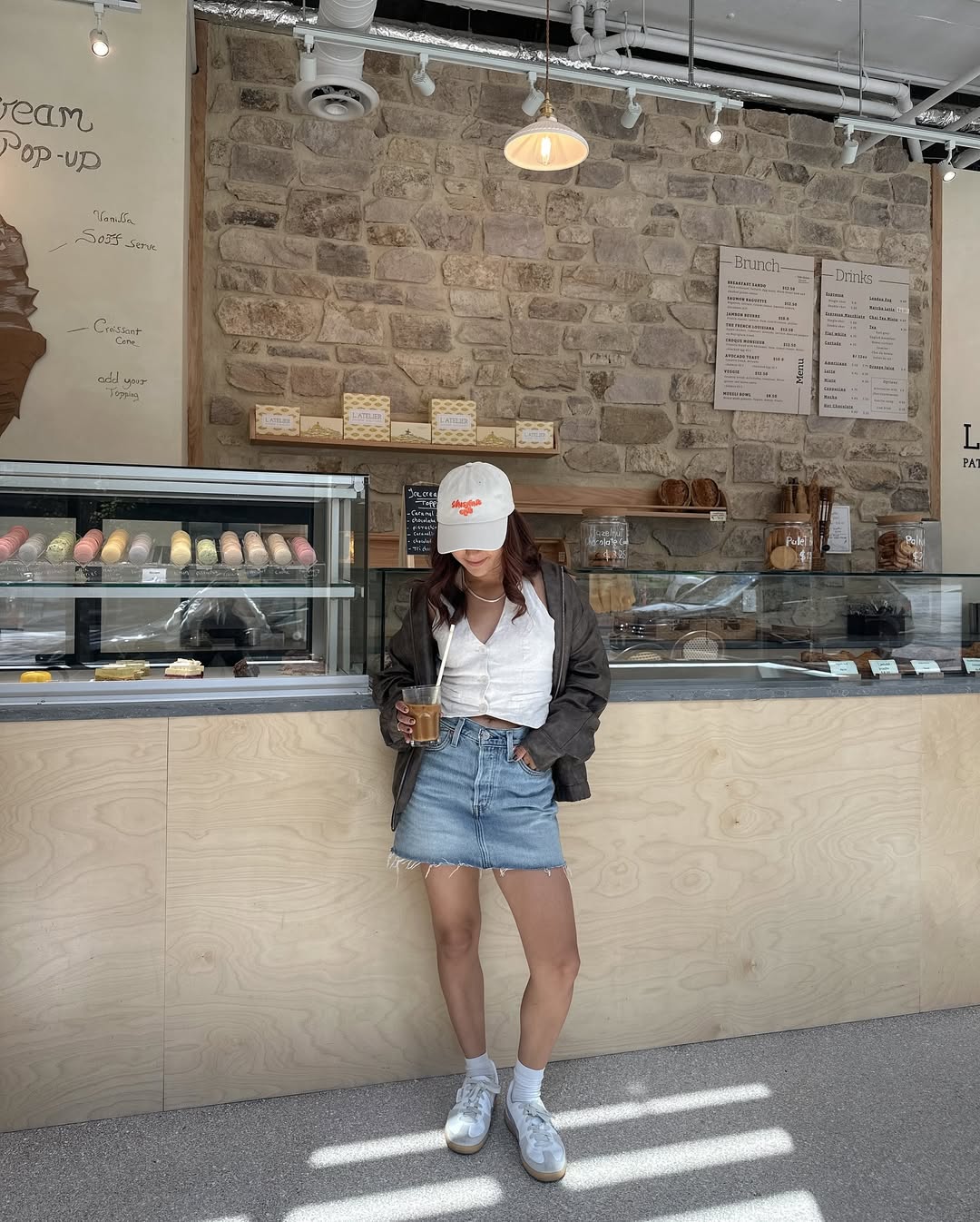 Denim Mini Skirt With White Tank And Bomber Jacket