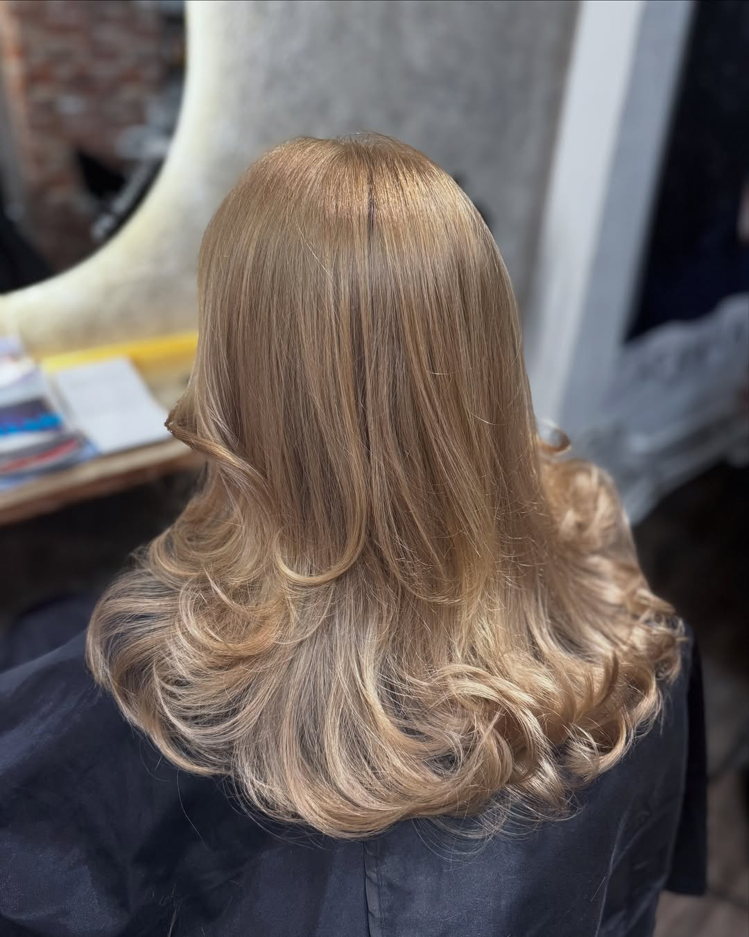 Dirty Blonde Layered Hair With Bouncy Curls