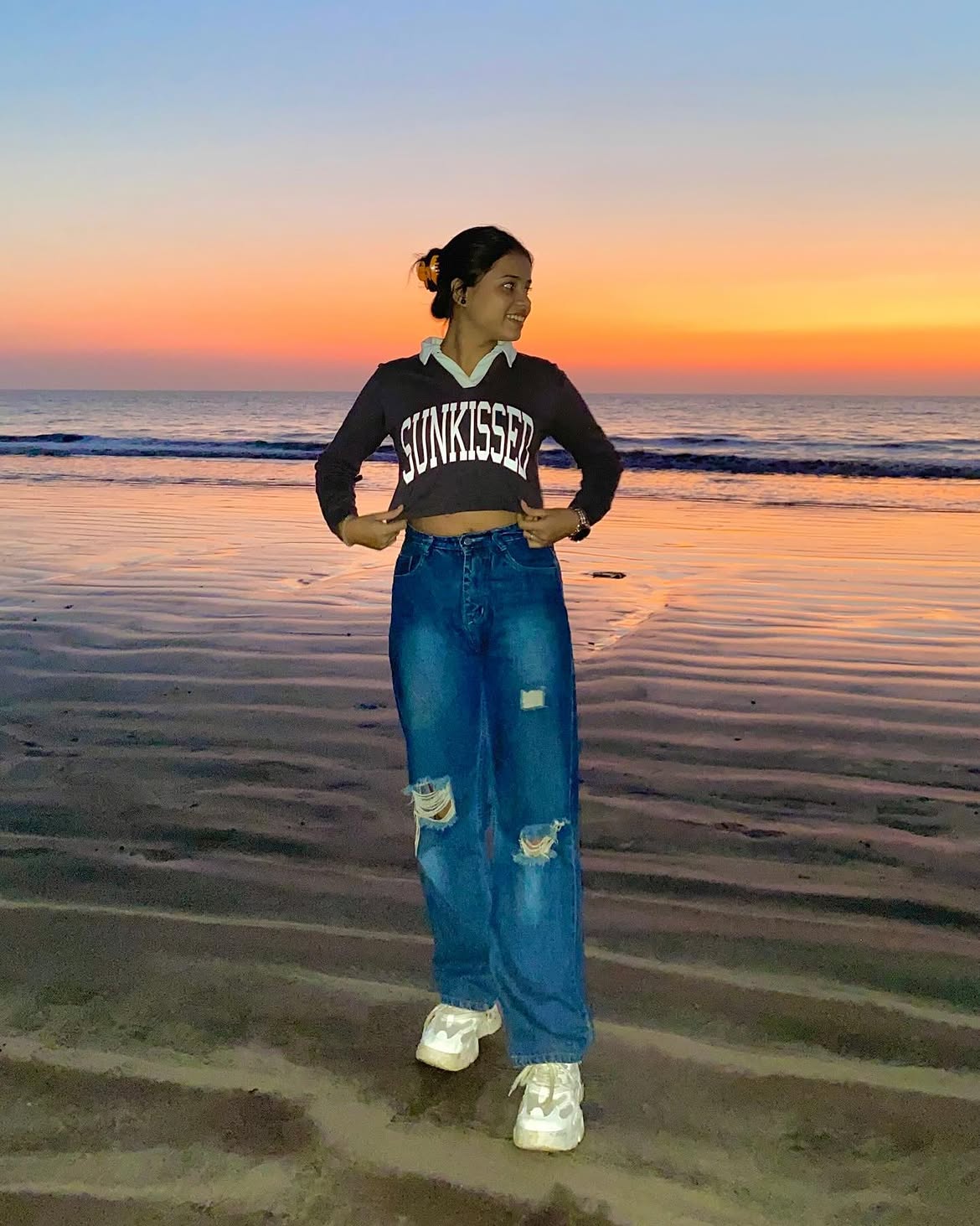 Distressed Denim With Cropped Graphic Sweater