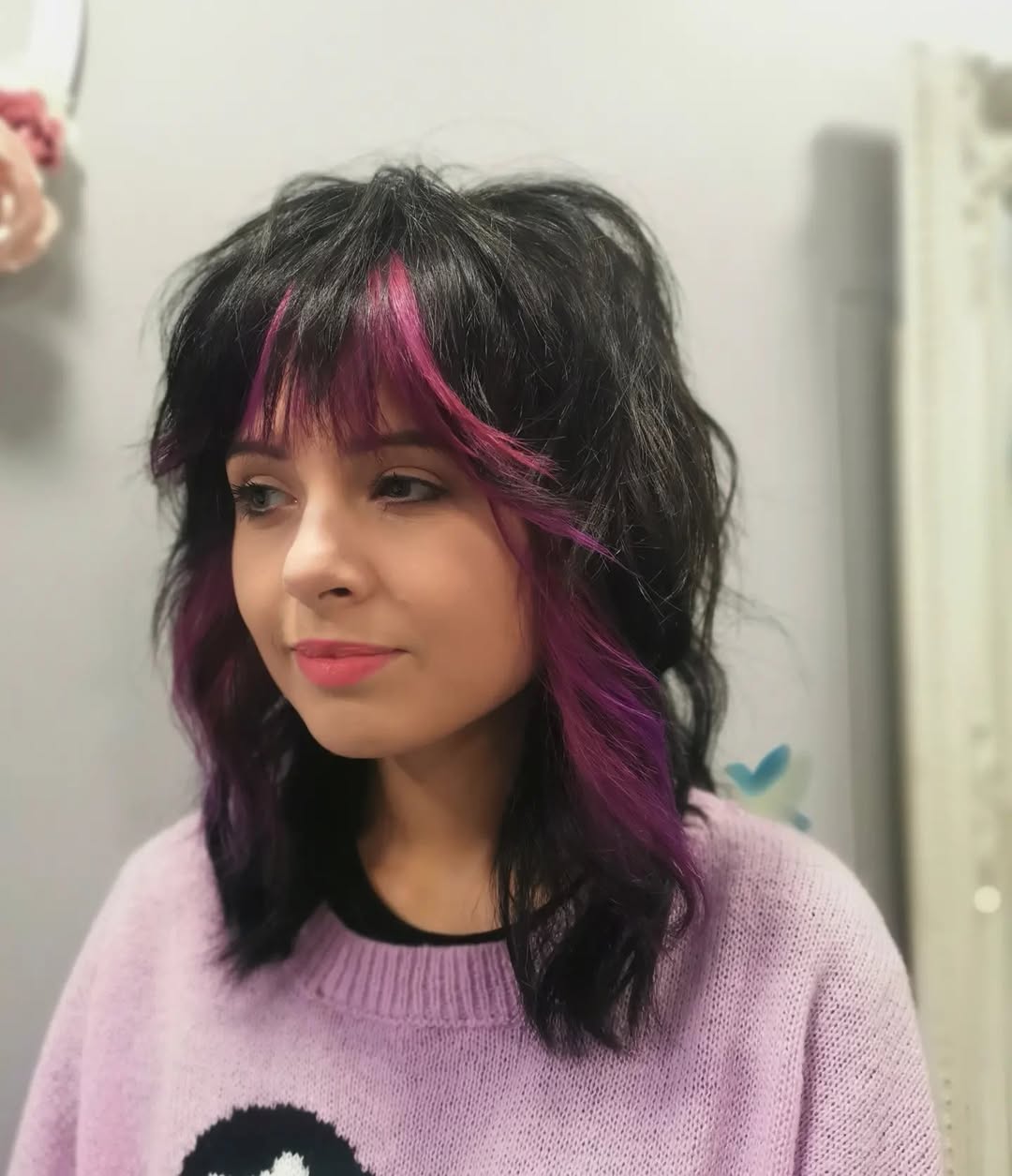 Edgy Black Wolf Cut With Pink Peekaboo Strands