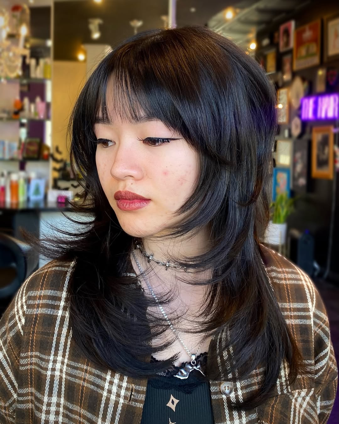 Edgy Black Wolf Cut With Wispy Bangs