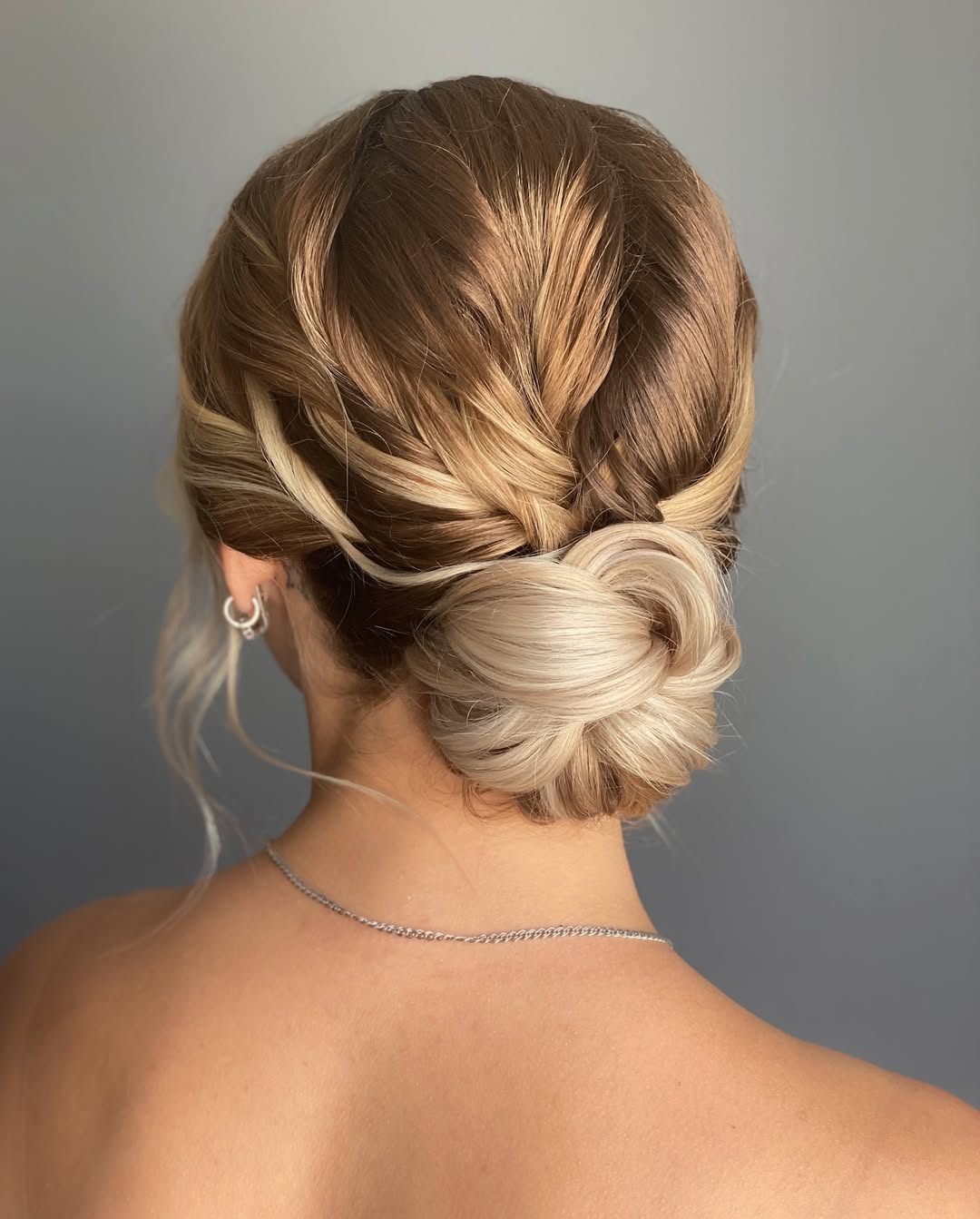 Effortless Blonde Twisted Low Bun Updo