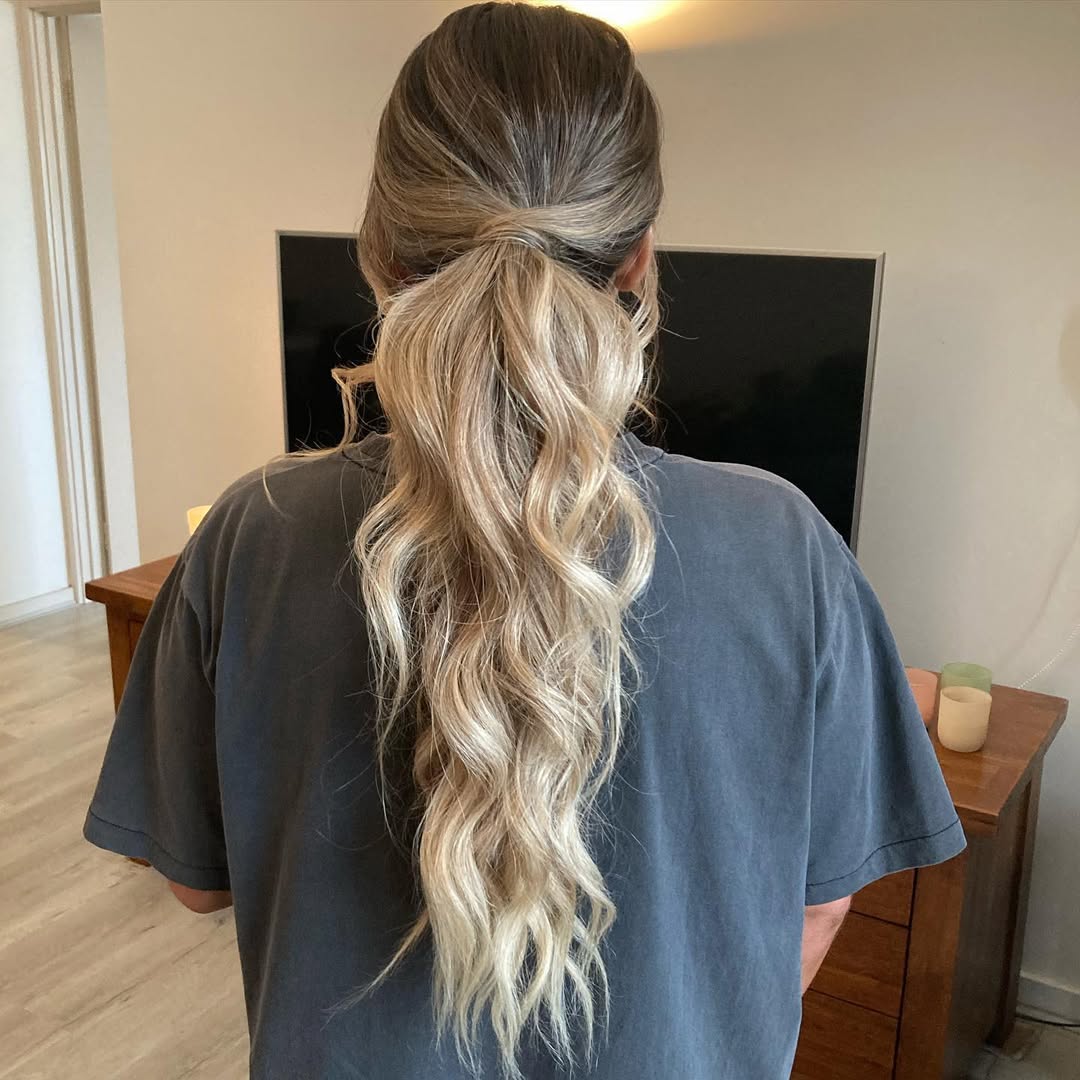 Effortless High Ponytail With Loose Waves