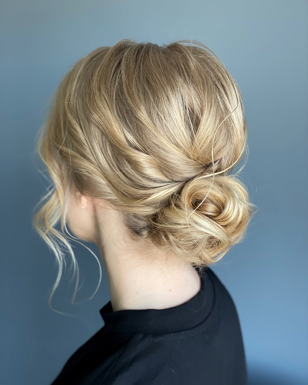 Effortless Messy Low Bun Blonde Updo