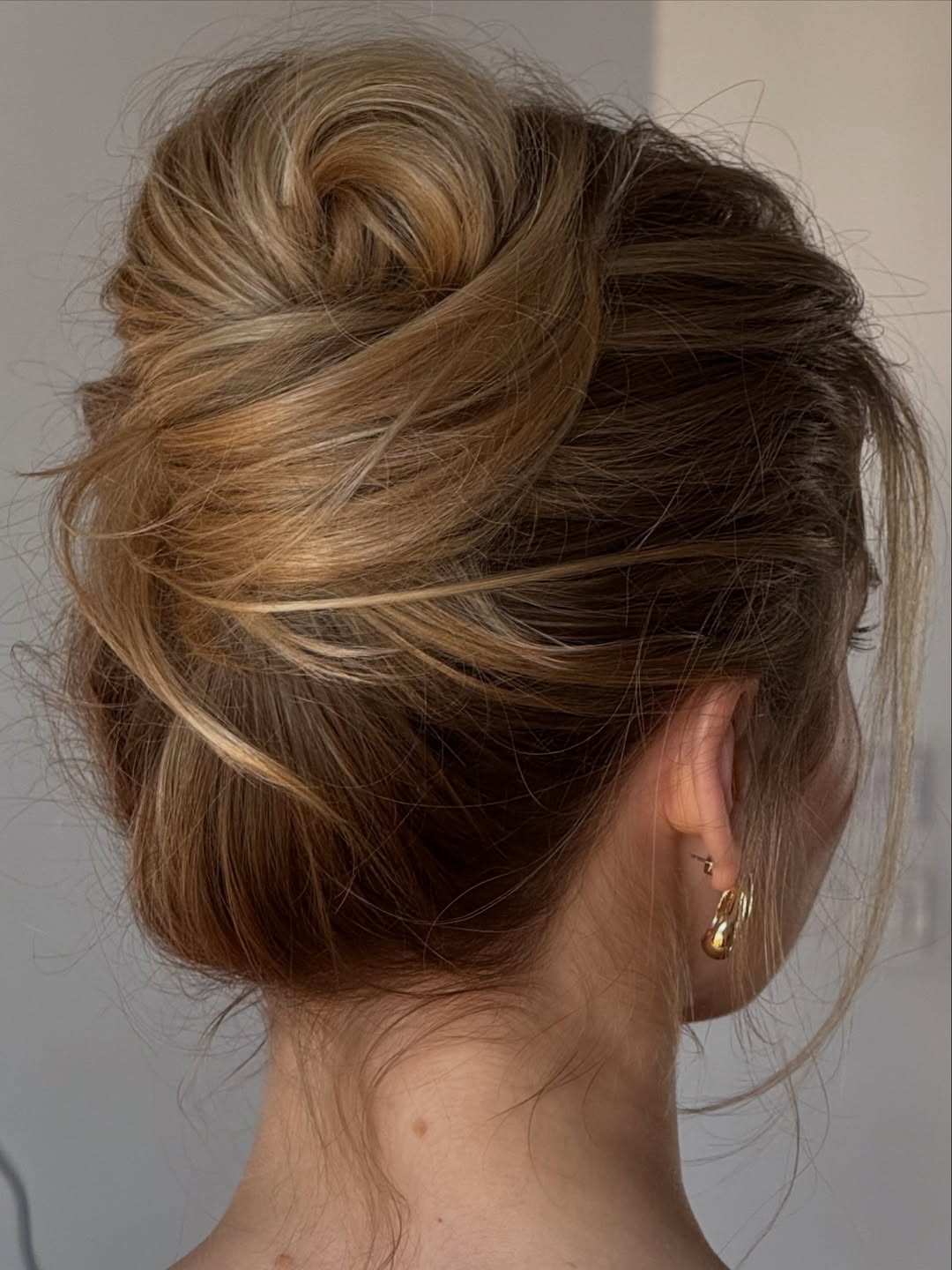 Effortless Messy Updo With Honey Blonde Highlights