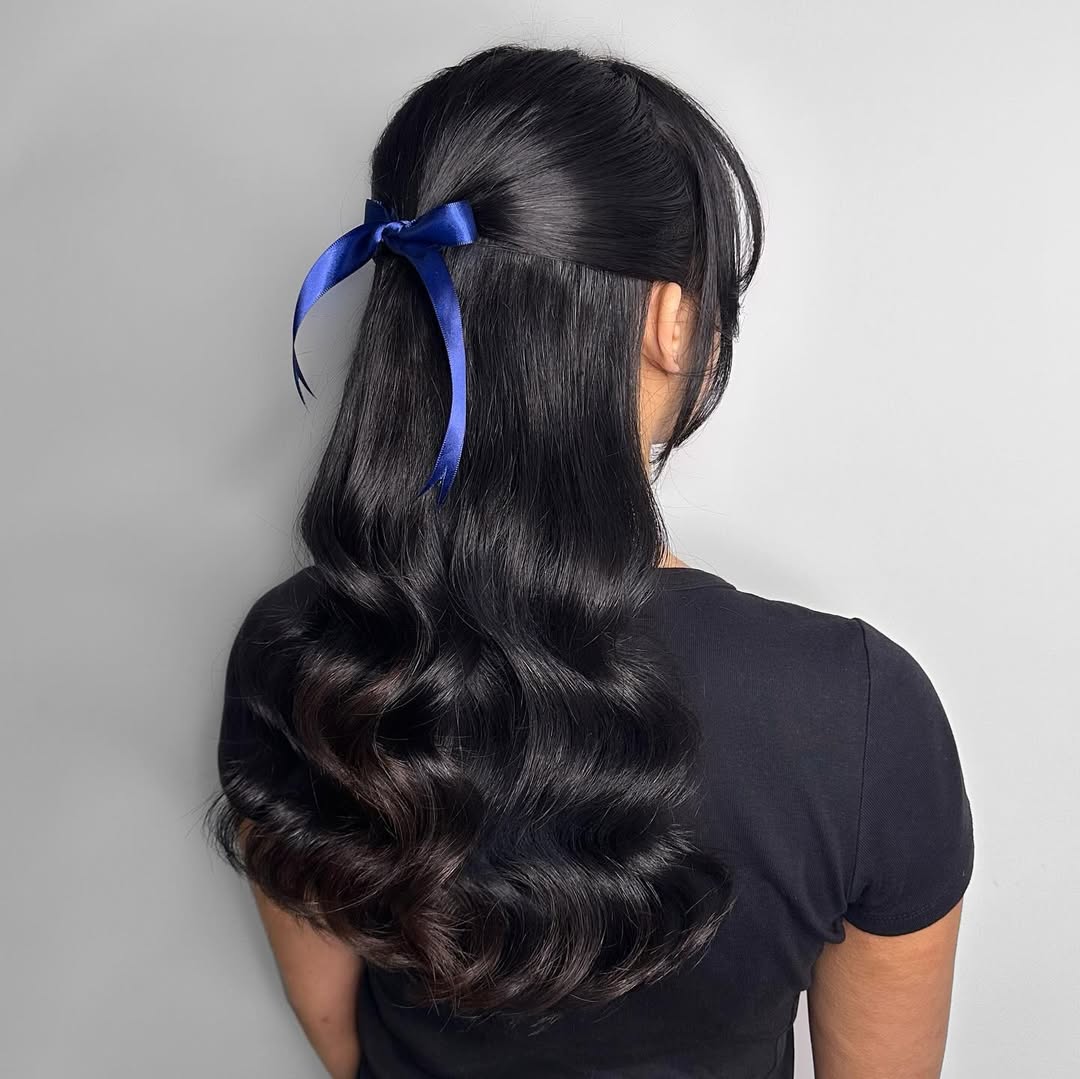 Elegant Half-Up Waves With Royal Blue Ribbon