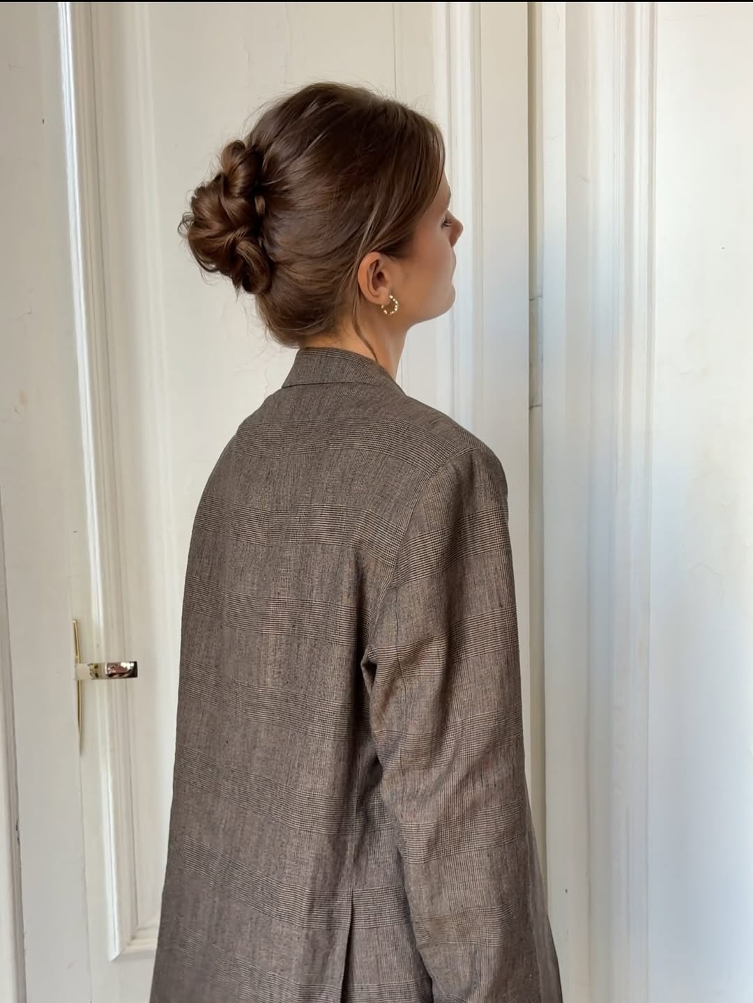 Elegant Low Bun With Soft Face-Framing Layers
